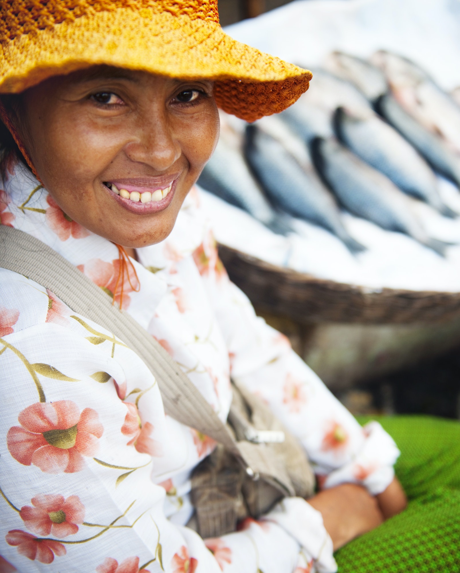 Indigenous Cambodian Woman Selling Fish In A Market